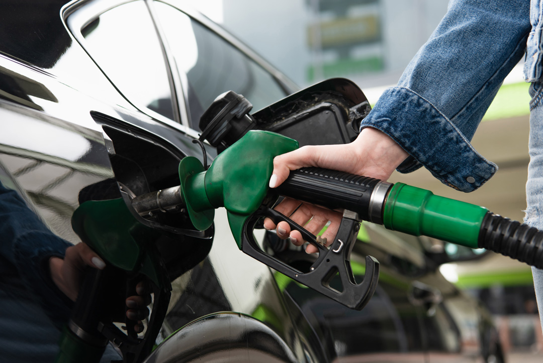 cropped-view-of-woman-fueling-car-on-gas-station-2023-11-27-04-55-36-utc